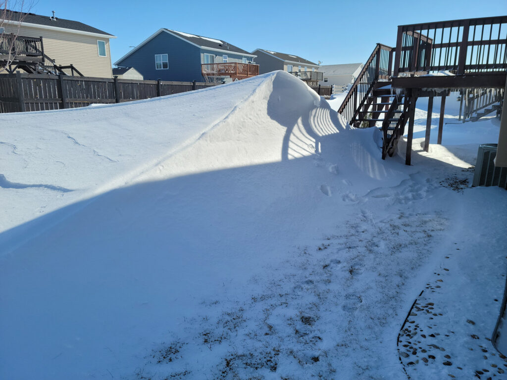A snowdrift as tall as my deck.