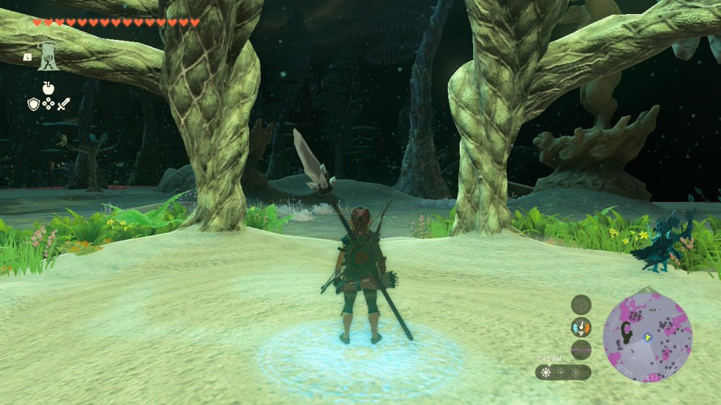 Zelda: TotK screenshot - Link standing under a Lightroot staring out into a lit Depths.